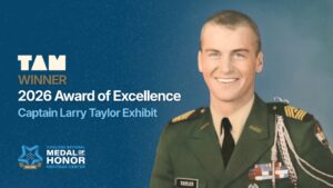 Graphic announcing TAM Winner 2026 Award of Excellence for the Captain Larry Taylor Exhibit, featuring a portrait of Captain Larry Taylor in uniform alongside the Coolidge National Medal of Honor Heritage Center logo.
